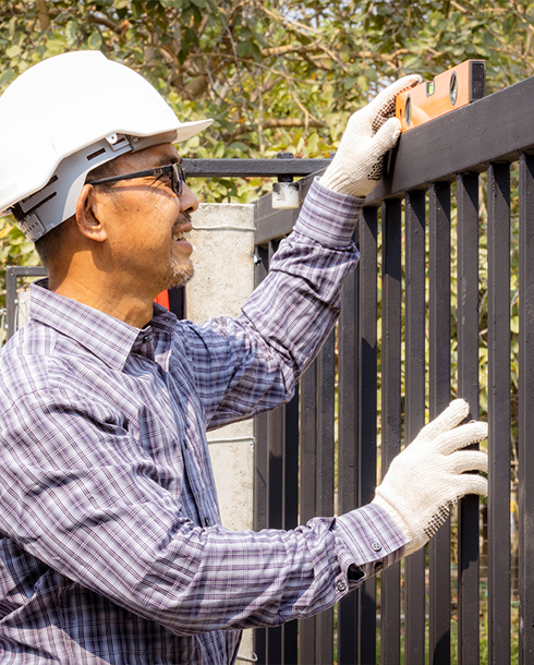 contractor working on a fence